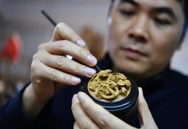 In pics: Wood carving works from China’s Fujian tell China stories to world