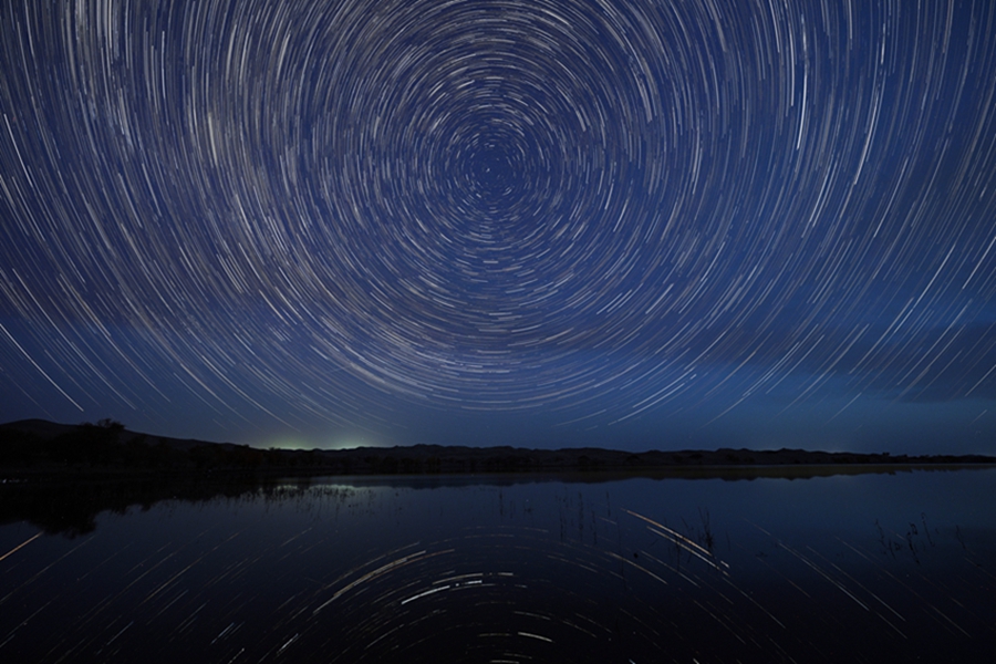 Brilliant starry sky over Luobu Lake in NW China's Xinjiang