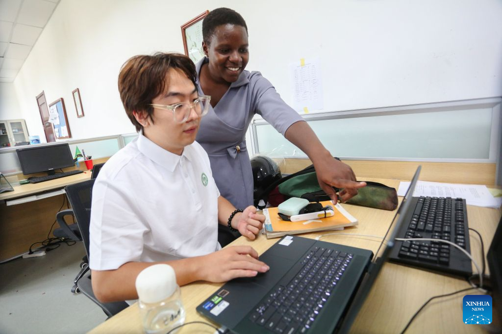 Tanzanian Chinese language teacher Gloria Mshana (R) exchanges teaching insights with Chinese volunteer teacher Liu Mu at the Confucius Institute at the University of Dar es Salaam in Dar es Salaam, Tanzania, Oct. 1, 2026. As the world prepares to mark World Teachers' Day on Oct. 5, Chinese and Tanzanian educators are joining forces to expand Chinese language education in Tanzania, blending native linguistic expertise with localized cultural insights.(Xinhua/Emmanuel Herman)