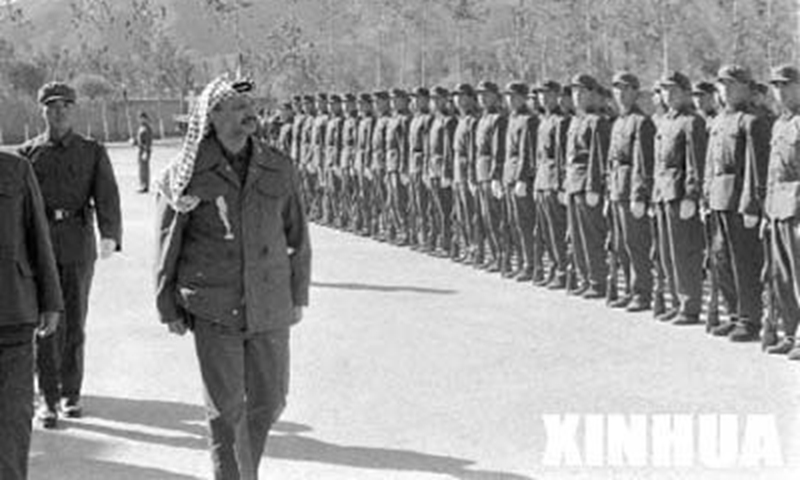 PLO leader Yasser Arafat inspecting the People’s Liberation Army of China