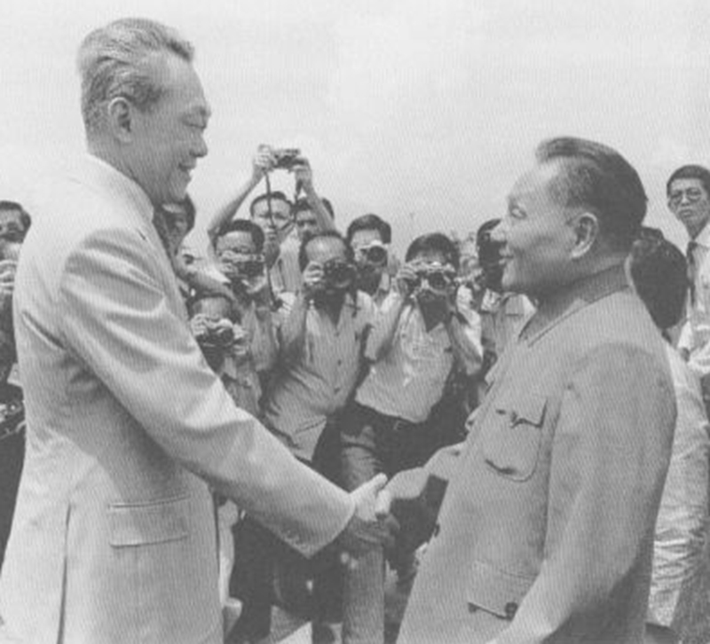 Deng Xiaoping shaking hands with Prime Minister Lee Kuan Yew at the airport during his visit to Singapore, November 1978