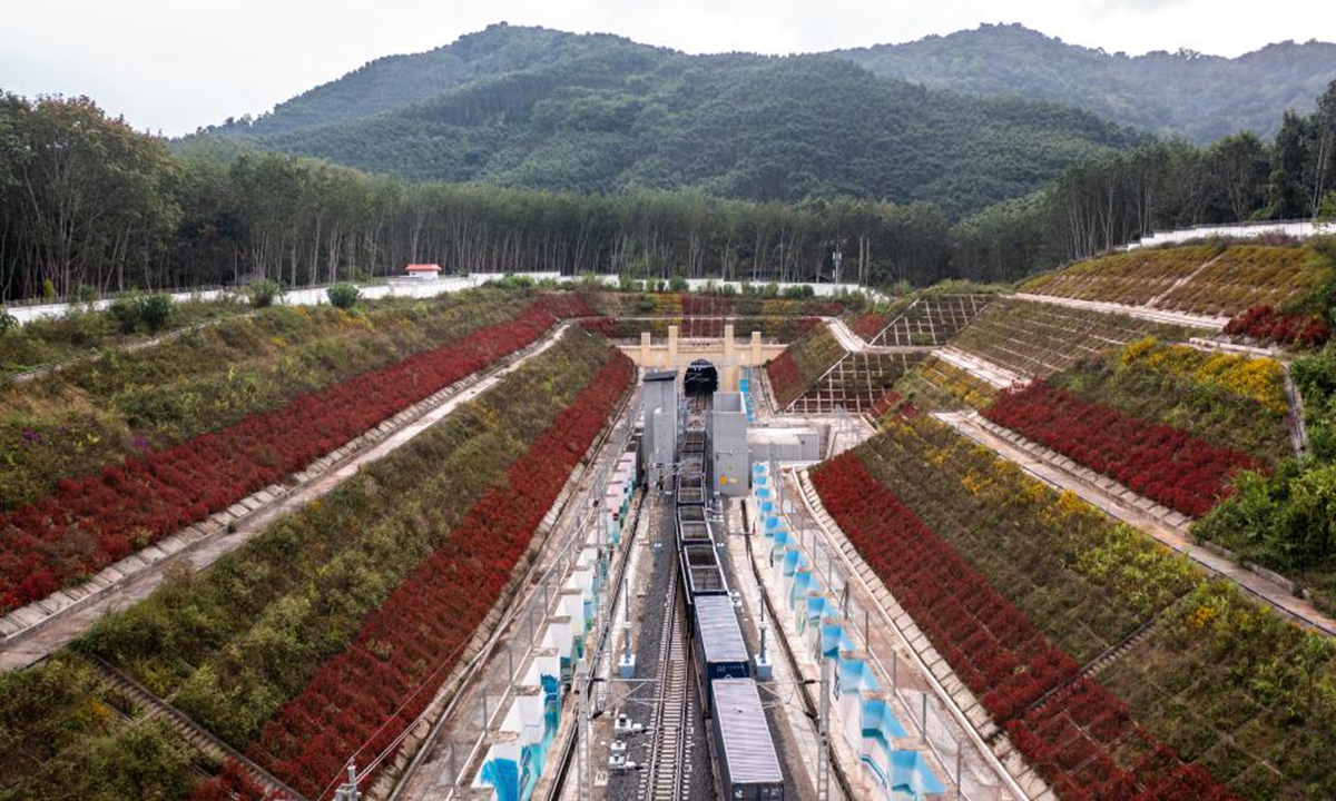 This aerial photo taken on Nov. 24, 2022 shows a freight train to enter the China-Laos Railway's Friendship Tunnel connecting Mohan in southwest China's Yunnan Province and Boten in northern Laos. (Photo: Xinhua)