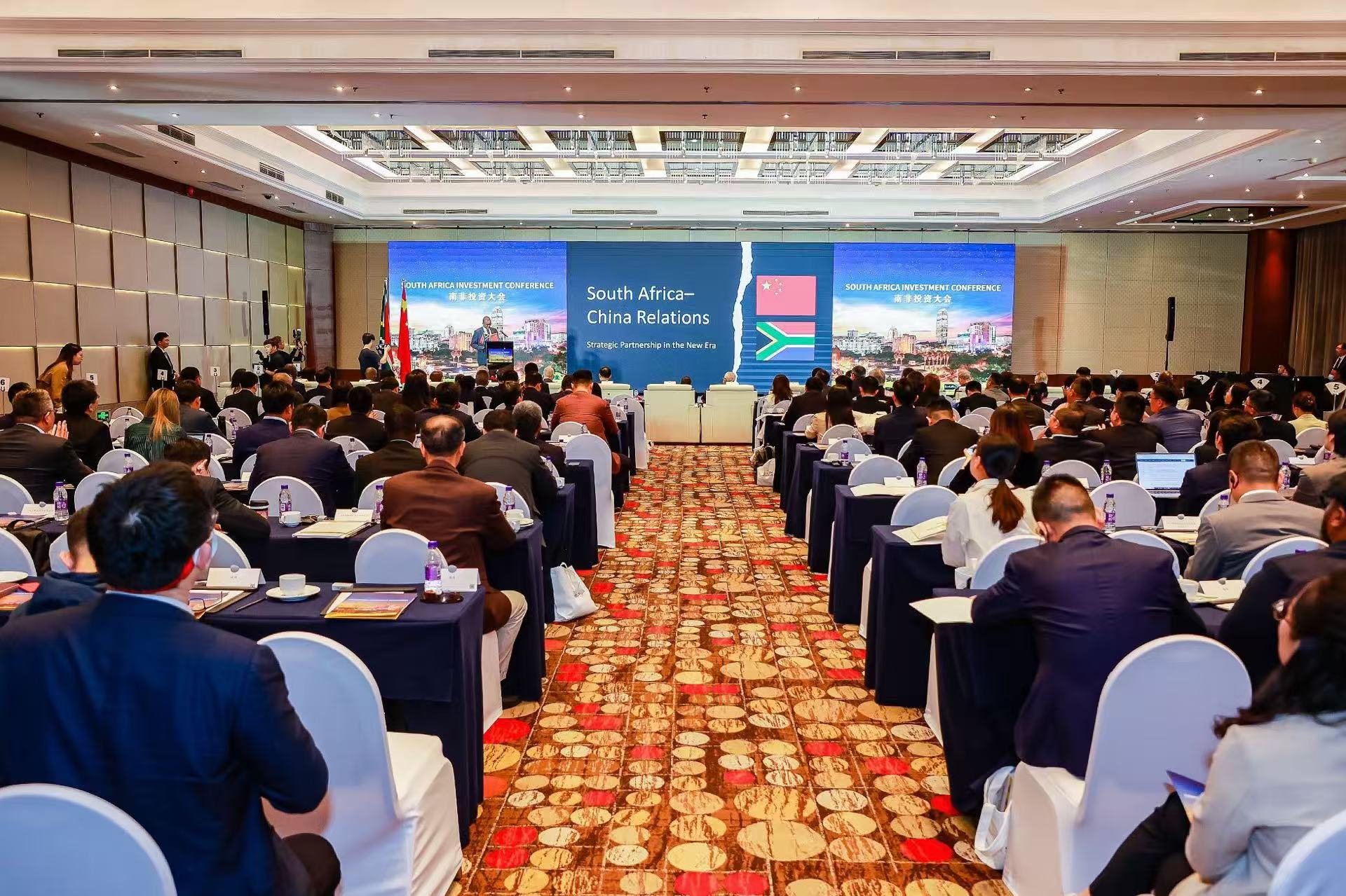 Representatives attend the investment conference themed 