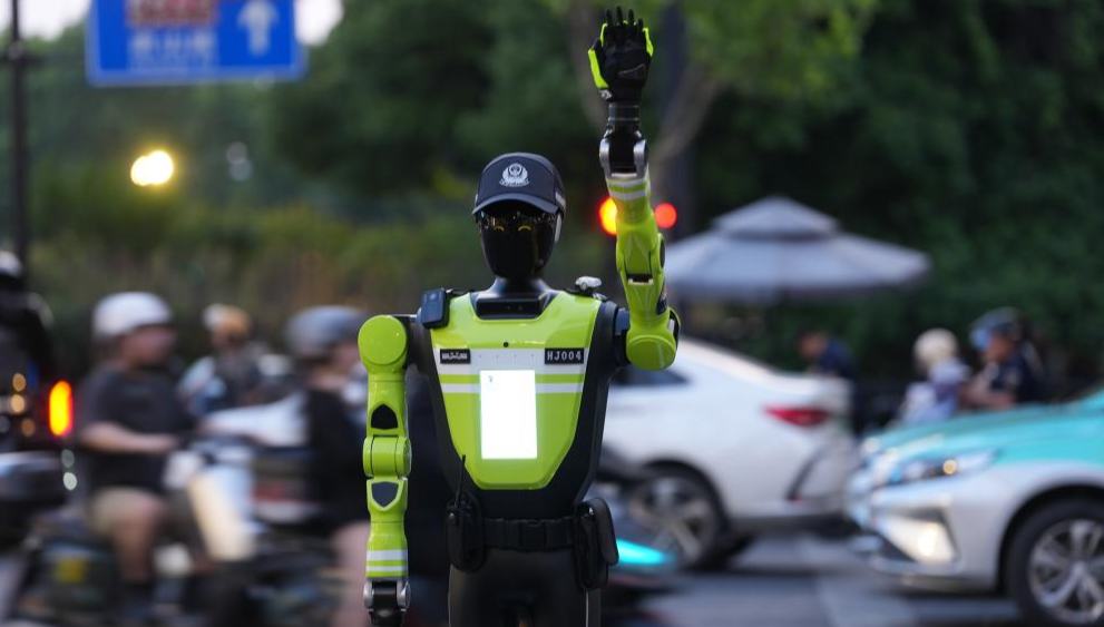 Intelligent traffic management robots deployed in Hangzhou 	 	An intelligent traffic management robot is on duty at a crossroad in the Hubin business area of Hangzhou, east China's Zhejiang Province, May 11, 2026.  Fifteen intelligent traffic management robots have been deployed at key intersections of the West Lake scenic area, Hubin business area, and main urban roads in Hangzhou.