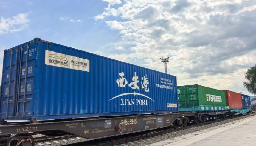 China-Europe freight train, an artery for growth between Xi'an and Almaty 	 	An aerial drone photo taken on June 25, 2026 shows a staff member operating a crane to handle containers of the China-Europe freight train at the Kazakhstani land port for Xi'an in Almaty, Kazakhstan. In November 2013, the first Chang'an China-Europe freight train departed from Xi'an to Almaty in Kazakhstan, making the two cities ever since become key transit hubs along Asia-Europe transportation route.