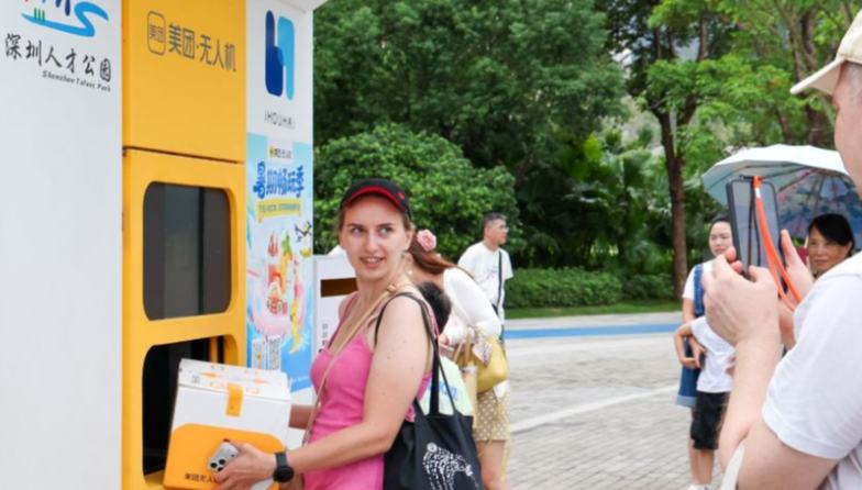 Foreign tourists explore tech-themed tours in Shenzhen 	 	Foreign tourists experience Meituan's unmanned delivery service at a park in Shenzhen, south China's Guangdong Province, Aug. 3, 2026. With the deep application of the achievements of emerging industries, many inbound foreign tourists choose science and technology tour as the theme of their journey in the Chinese cities.