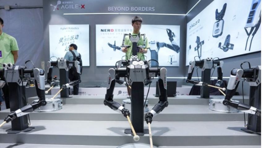Robots showcase diverse applications at 2026 World Robot Conference 	 	A staff member demonstrates a dual-arm operating system at the 2026 World Robot Conference (WRC) in Beijing, capital of China, Aug. 20, 2026. Opened in Beijing on Wednesday, the 2026 WRC features more than 300 exhibitors and over 2,000 exhibits under the theme "Human-Robot Symbiosis, Production-Demand Convergence." 