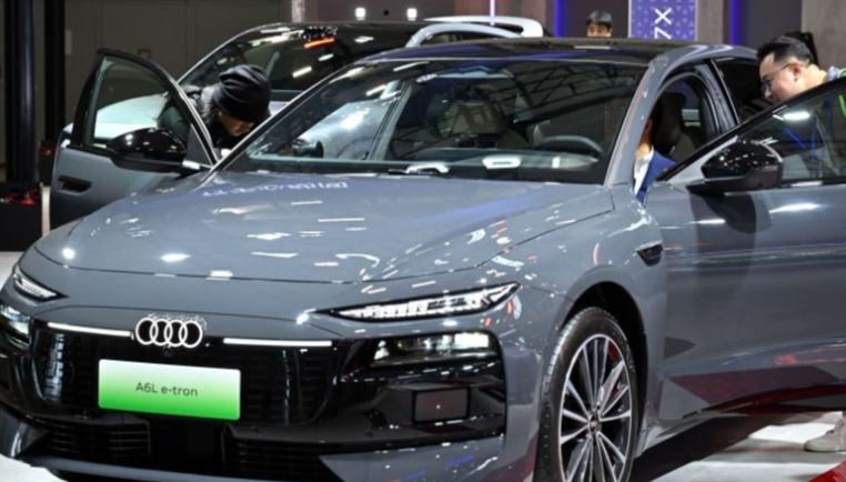 2026 World New Energy Vehicle Congress opens in Haikou, China's Hainan 	 	People watch a new energy vehicle during the 2026 World New Energy Vehicle Congress in Haikou, south China's Hainan Province, Sept. 22, 2026. The 2026 World New Energy Vehicle Congress (WNEVC) opened here on Tuesday. 